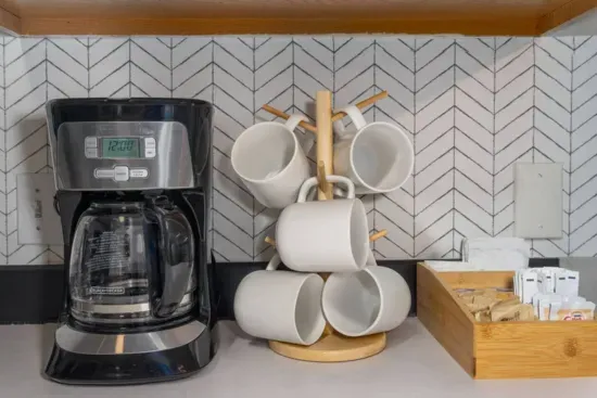 Selection of coffee, tea, creamer and sugar provided