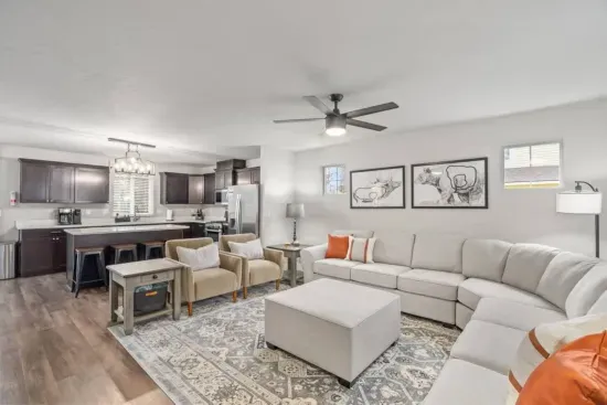 LIVING / DINING: Relax on the comfy couch in the living room with a cozy gas fireplace and a 64" smart TV for streaming your favorite shows and movies. Enjoy a meal at the dining table seating 8, with additional space at the kitchen island for 4.