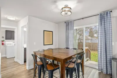 Enjoy a meal at the dining table seating 8, with additional space at the kitchen island for 4. 