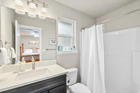 MAIN BATHROOM: Walk-in shower, premium toiletries, blow dryer, and essentials.