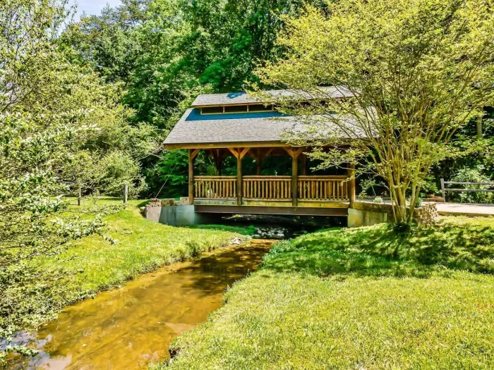 Watch the creek flow under the gazebo as you enjoy a family picnic.