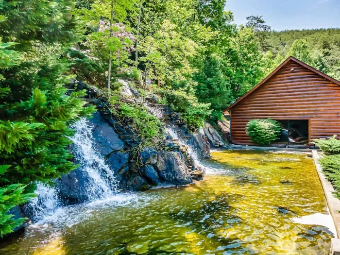 Waterfall directly behind the swimming pool!