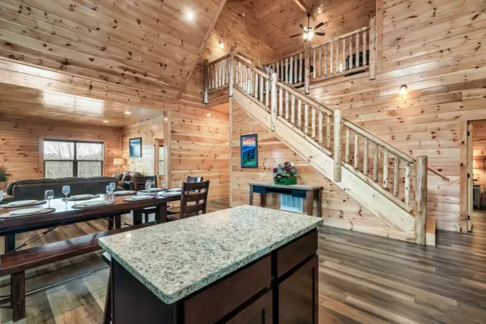 Island bar in the kitchen I Steps leading to the game room and two additional bedrooms