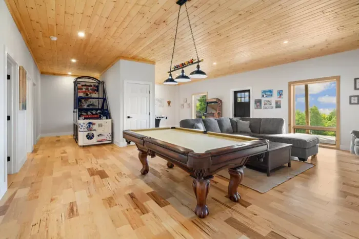 Our game room features a pool table, multi cade with 1,000 + games, Hockey game, basketball game and flat screen TV!