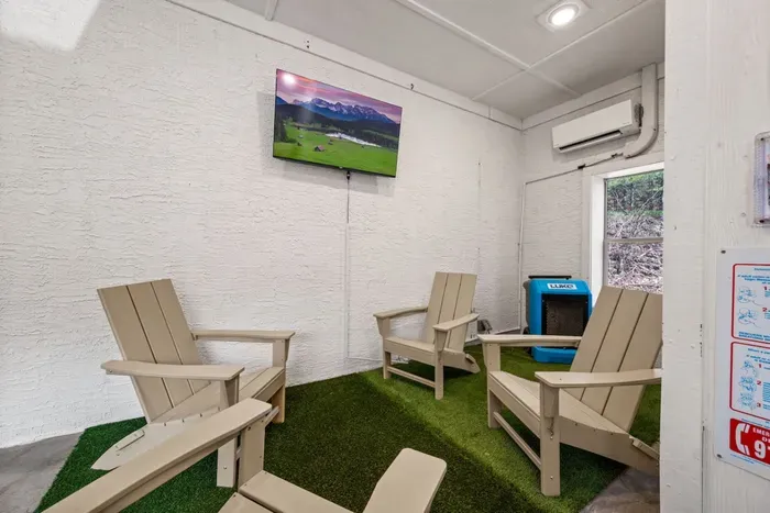 Pool room features a lounge area and flat screen TV