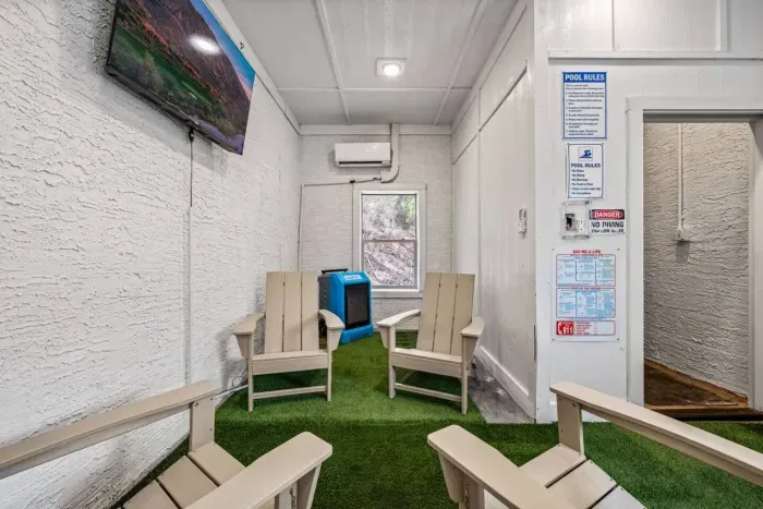 Pool room features a lounge area and flat screen TV