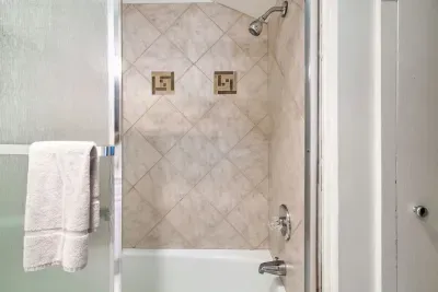 Upstairs tub and shower.