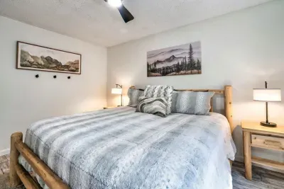 Main floor primary bedroom with King bed and private full bathroom with walk-in shower.