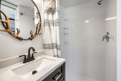 Primary ensuite main floor bathroom with walk-in shower.