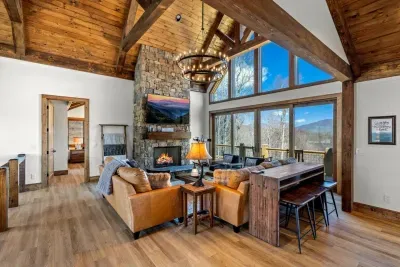 The table behind the sofa provides additional seating for three and another place to play cards.