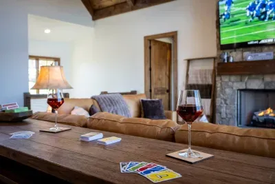 The table behind the sofa provides additional seating for three and another place to play cards.