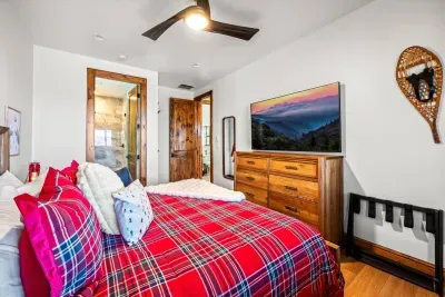 This bedroom features an en-suite bathroom as well.