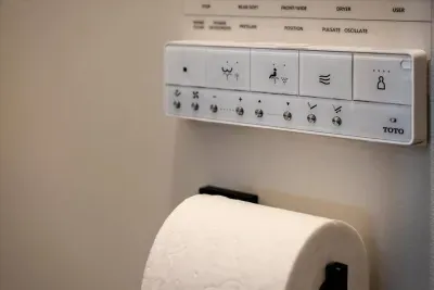 The bathroom has a high-tech Toto toilet featuring a heated seat and includes both wash and dry functions.