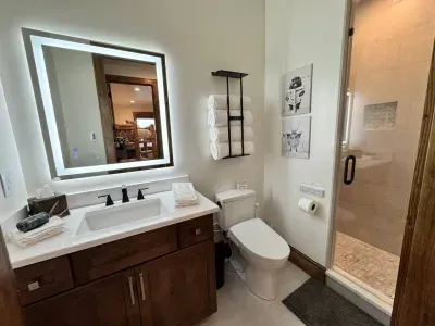 The bunk bathroom includes heated floors, a lighted mirror, and a Toto Washlet (Bidet) complete with a heated seat.