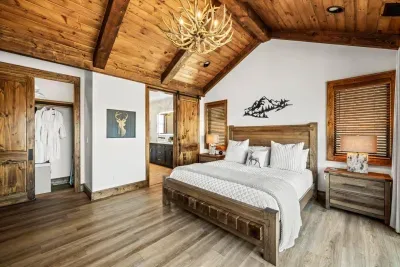 The room is designed with comfort in mind, adorned with plush bedding and stylish accent pillows that create a serene atmosphere.  The closet has two plush robes for guests to enjoy.