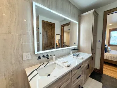 Enjoy plenty of cabinet space for your toiletries, as well as heated floors to keep your feet warm in the winter.