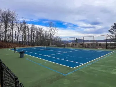 Tennis and pickle balll courts right behind our building!