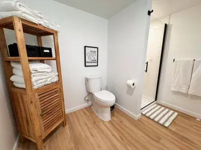 Lots of cabinet space for towels, toilet paper and shelves for your toiletries.  And the sign says it all!