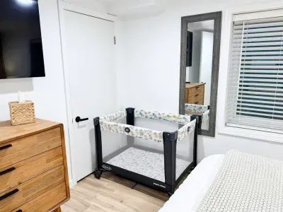 A pack-n-play is folded in the closet for your needs.