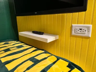 Under each TV is a ledge for your phone and a USB/Plug outlet.