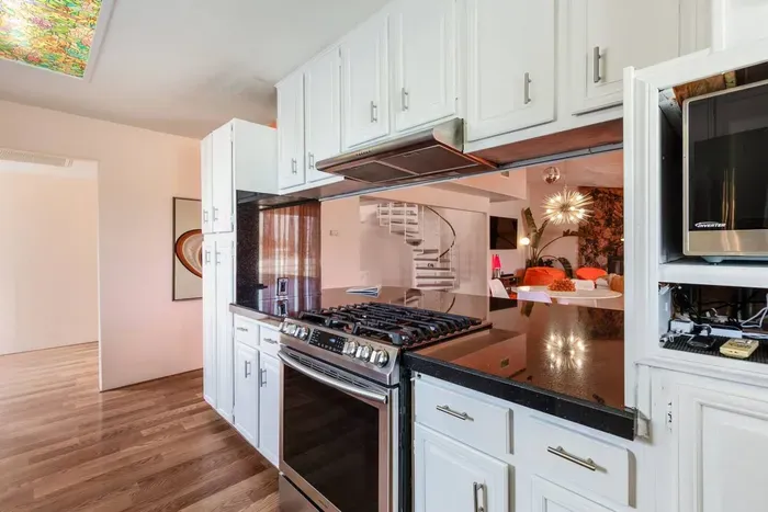 Open concept floor plan means you can still get the lowdown while fixing up some boss snacks.