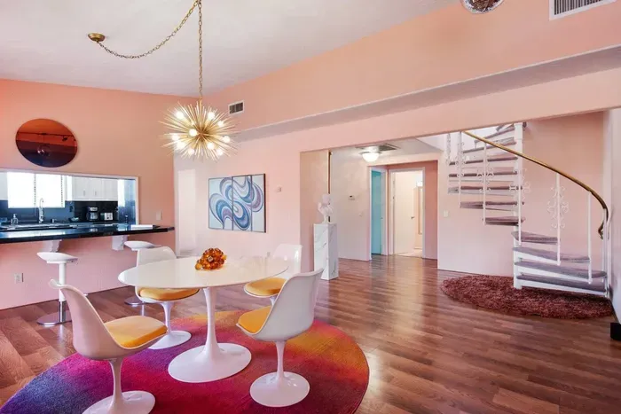 The open concept floor plan with pops of blazin' sunset colors makes for the perfect place for gettin' the lowdown.