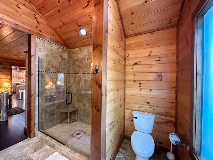 Main level primary with custom walk in shower.