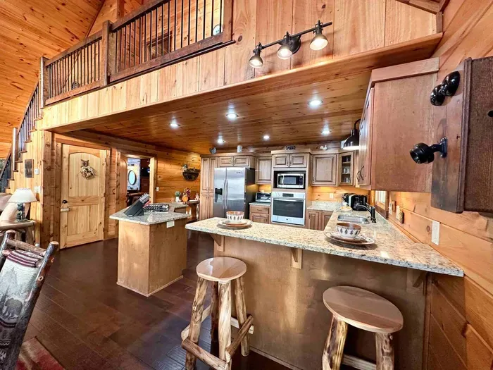 Spacious kitchen with gas range & wall oven to prepare a delicious meal.