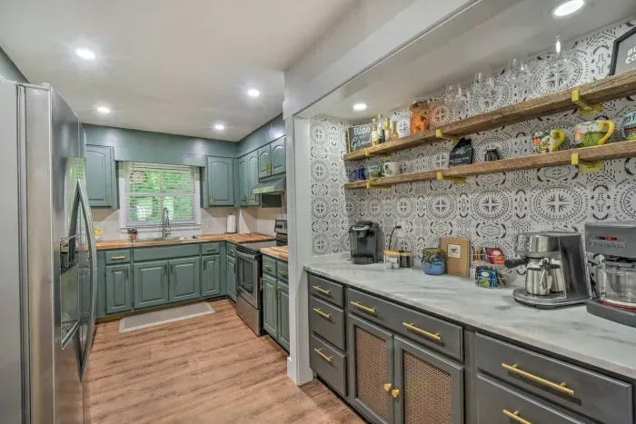 Discover culinary bliss in our fully stocked kitchen, where a comprehensive selection of utensils and essentials awaits.