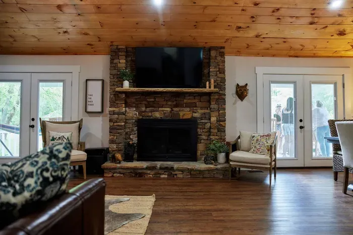 Be captivated by the grandeur your mighty fireplace and large flat screen in the living room. Embrace the perfect blend of warmth and entertainment in this inviting space.