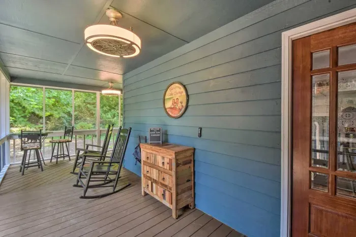 Take a moment to enjoy the view from your porch, featuring cozy sitting chairs that invite you to relax and immerse yourself in the picturesque surroundings.