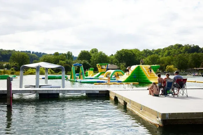 Joyful water fun and scenic relaxation unite at nearby Lake Chatuge. Kids delight in splash and water slides while others savor the view from the deck, creating cherished moments for all.