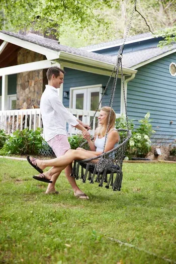 Pure joy on the backyard swing, where relaxation meets fun in your outdoor oasis