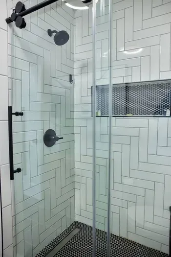 Experience the essence of relaxation in your newly renovated inviting shower, where modern design and soothing water come together to create a refreshing oasis.