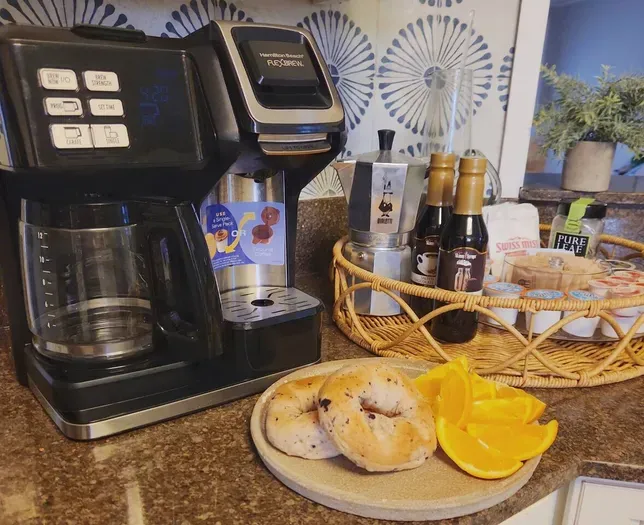 Coffee maker takes ground coffee & K-cups. Kitchen also stocked with a percolator.