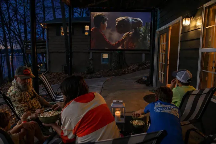 When the day winds down, pile on the patio for movie night to finish it off on the big screen.