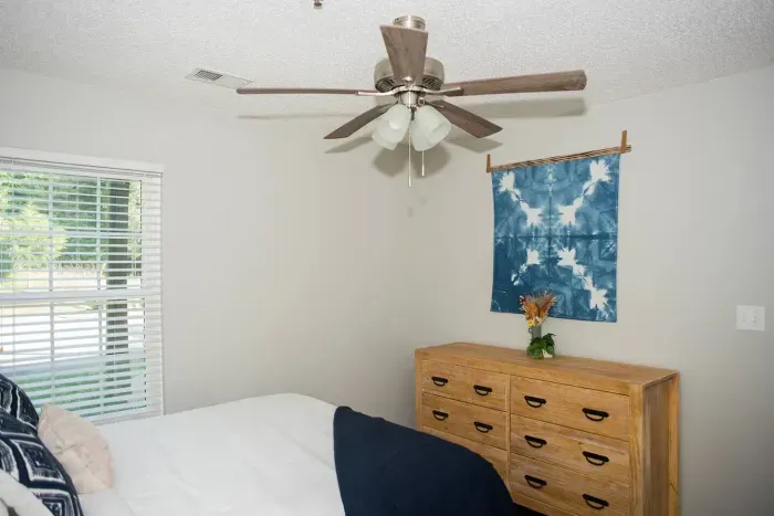 A symphony of art, light and ambiance: This bedroom seamlessly blends captivating artwork, natural lighting  and thoughtfully designed interiors for a truly enchanting atmosphere