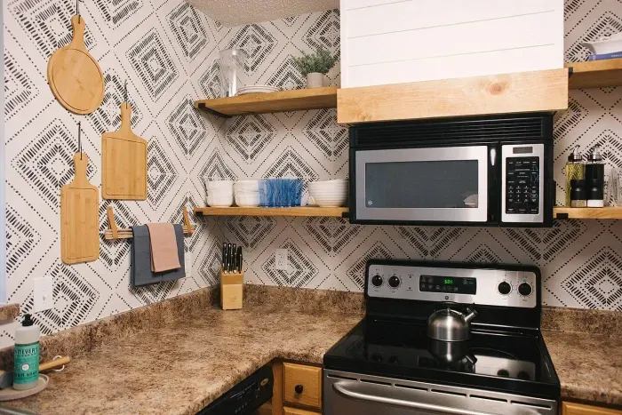 Kitchen stocked with stoneware & plasticware for poolside/patio enjoyment.