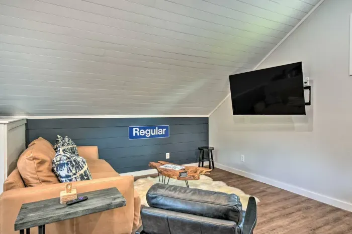 Relax in front of the flat screen TV on the cozy cushions, the perfect spot to unwind and enjoy your favorite shows