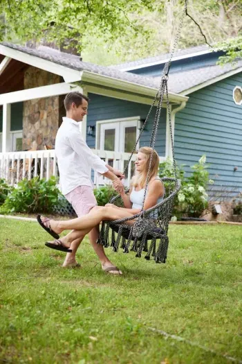 Pure joy on the backyard swing, where relaxation meets fun in your outdoor oasis