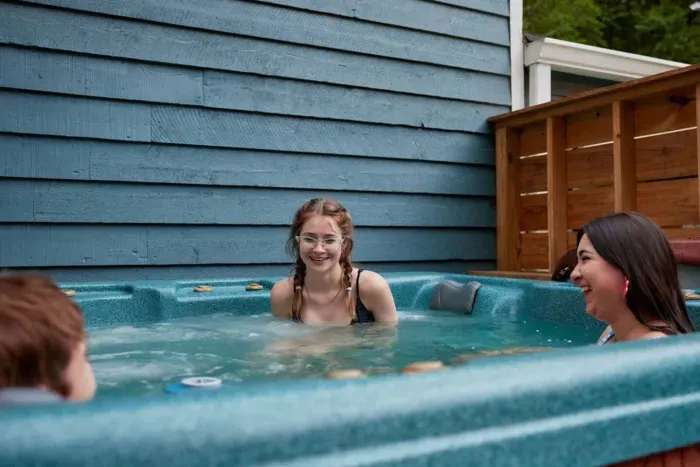 Fun-filled moments and laughter abound as families enjoy the jacuzzi together.