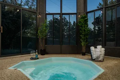 The hot tub is accessible from the master bedroom as well as the backyard and is enclosed for all-season use.