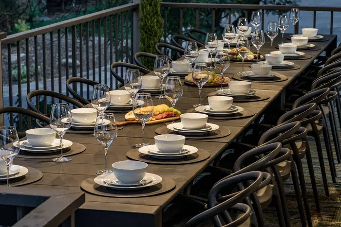 Outdoor patio with views of the Rockies allows for large gatherings to enjoy the fresh Colorado air. Deck accessible via kitchen and/or stairs from the outside backyard.