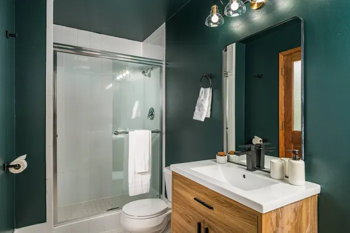 Shared bathroom with access directly to the outside backyard as well as the downstairs game room.