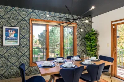 Smaller dining room setting right off the living room with access to the outdoor deck.