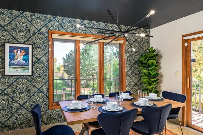 Smaller dining room setting right off the living room with access to the outdoor deck.