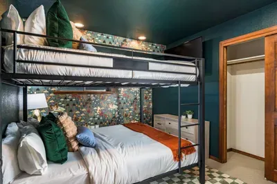 Downstairs, bunk beds with a window facing the side yard.