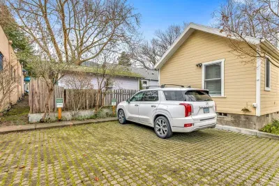 1 off street parking spot available. The second spot is reserved for front house guests.