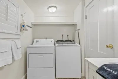 Laundry room in front house bathroom