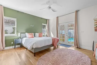 2nd master bedroom with french doors to pool